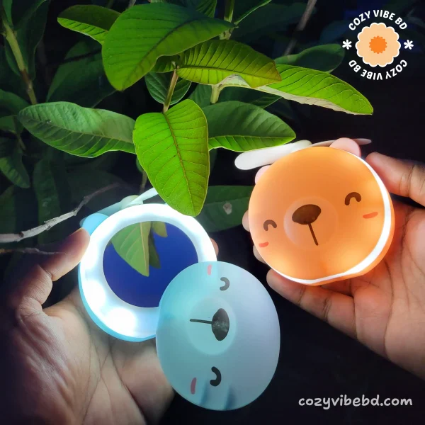 cute pocket makeup mirror with light and fan for girls 2 color variant front facing - image by cozy vibe bd