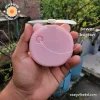 cute pocket makeup mirror with light and fan for girls showing the power button - image by cozy vibe bd