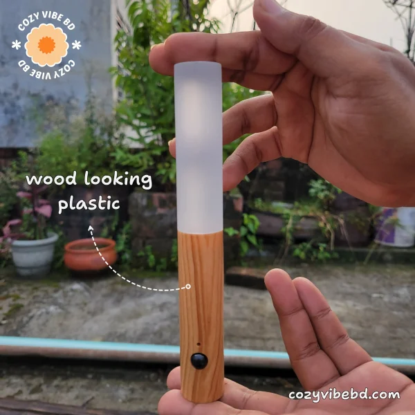 product motion sensor light - wood looking plastic handle is labeled with text - image by cozy vibe bd